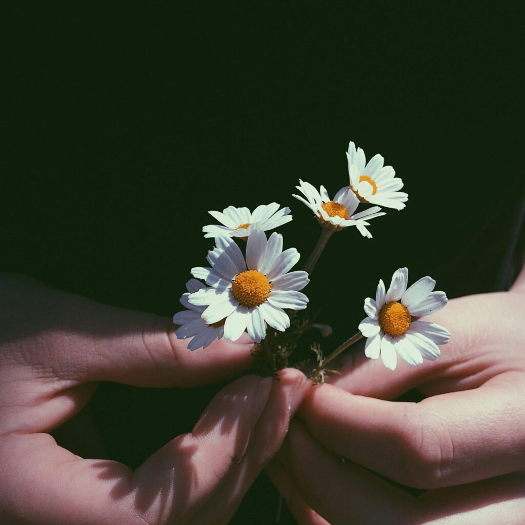 Women Holding Flowers
